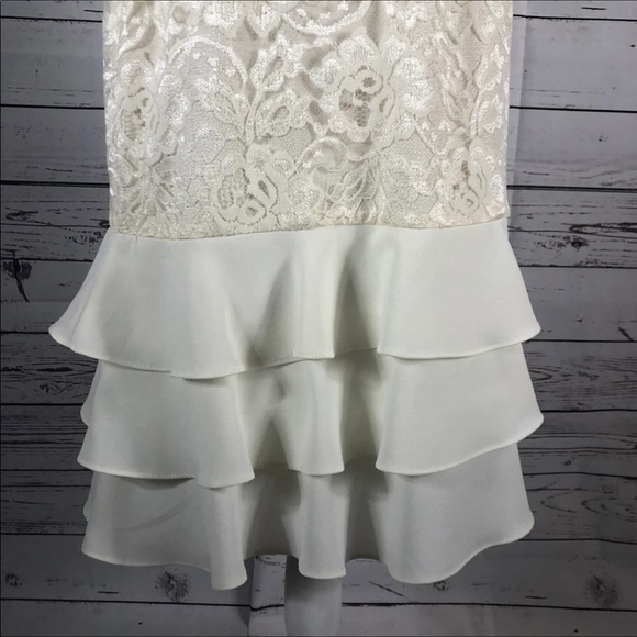 Leslie Fay sleeveless 
Beautiful lace dress with layered ruffles on the end. - Picture 6 of 12